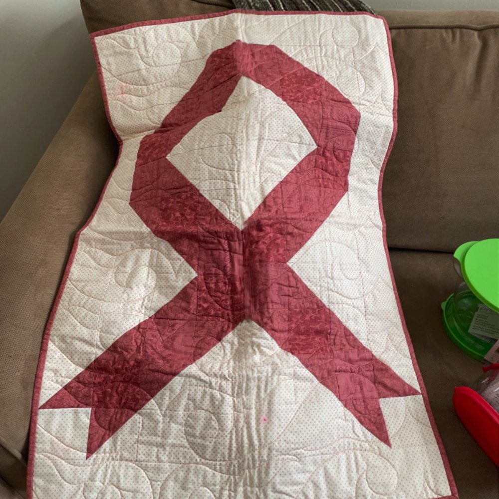 Pink ribbon lap quilt